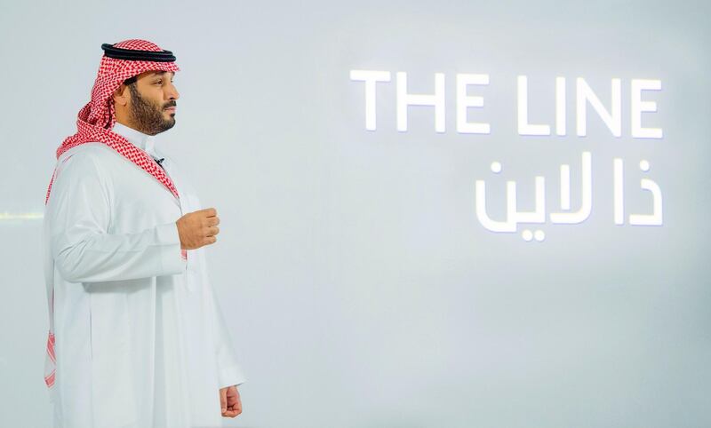 A handout picture provided by the Saudi Royal Palace on January 10, 2021, shows Saudi Crown Prince Mohammed bin Salman launching 'The Line', a green city that can accomodate about one million people, at NEOM, an area in the north-west of the kingdom currently under development . Saudi Arabia, the world's largest exporter of crude oil, announced today the launch of the green city with "zero cars, zero roads, zero CO2 emissions".
NEOM is on the list of the many mega-projects underway, intended to diversify the economy of Saudi Arabia which depends very largely on the export of oil. 

 - RESTRICTED TO EDITORIAL USE - MANDATORY CREDIT "AFP PHOTO / SAUDI ROYAL PALACE / BANDAR AL-JALOUD" - NO MARKETING - NO ADVERTISING CAMPAIGNS - DISTRIBUTED AS A SERVICE TO CLIENTS
 / AFP / Saudi Royal Palace / BANDAR AL-JALOUD / RESTRICTED TO EDITORIAL USE - MANDATORY CREDIT "AFP PHOTO / SAUDI ROYAL PALACE / BANDAR AL-JALOUD" - NO MARKETING - NO ADVERTISING CAMPAIGNS - DISTRIBUTED AS A SERVICE TO CLIENTS
