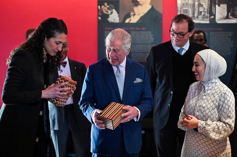 King Charles attempts to open a puzzle box made in Jordan. Getty Images