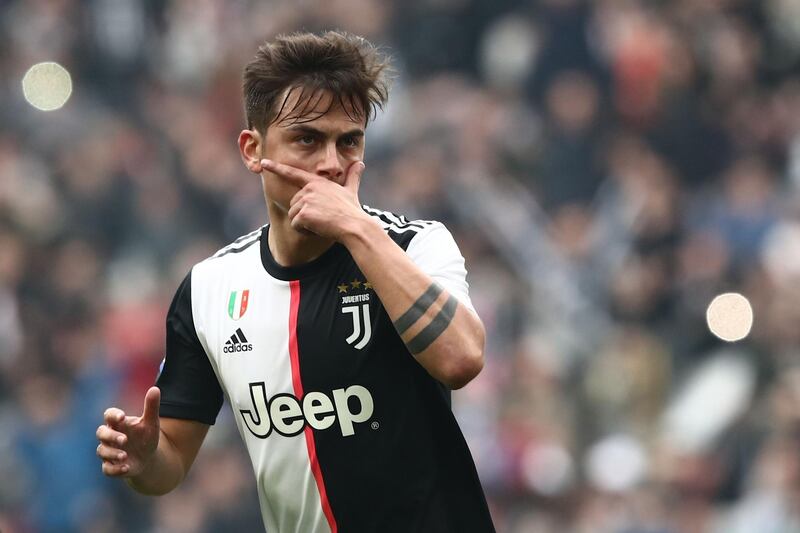 Juventus' Argentine forward Paulo Dybala celebrates after opening the scoring during the Italian Serie A football match Juventus vs Brescia on February 16, 2020 at the Juventus stadium in Turin. / AFP / Isabella BONOTTO
