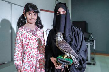 Ayesha Al Mansoori with her daughter and keen falconer, Osha Khaleefa Al Mansoori. Photo: Victor Besa for The National