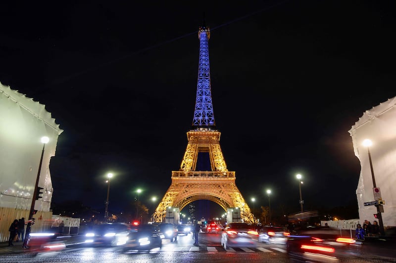 The Eiffel Tower is lit in the colours of Ukrainian flag in Paris. AFP