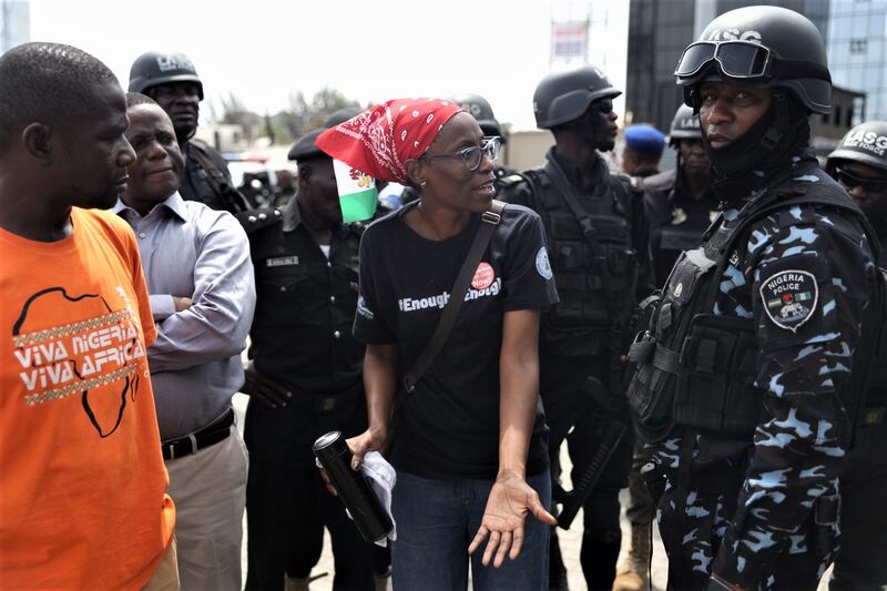 A protester confronts police. EPA