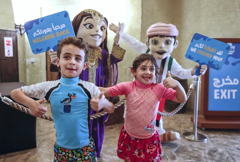 Abu Dhabi, United Arab Emirates, August 4, 2020.   Yas Waterworld Abu Dhabi Mascots and staff welcome visitors at the entrance.
Victor Besa /The National
Section: NA
Reporter: