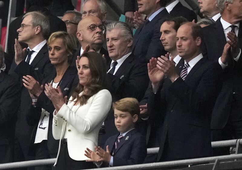 Prince William, Catherine, Duchess of Cambridge and Prince George in the stands during the Euro 2020 final between Italy and England in London.