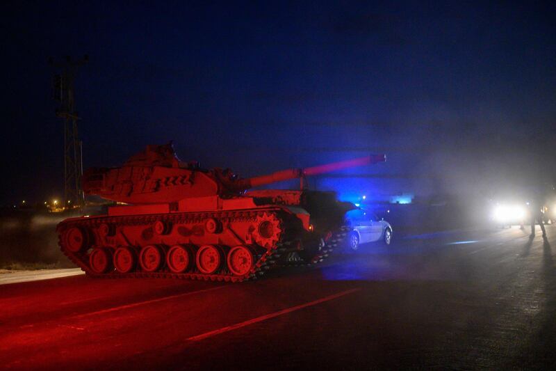 Turkish armed forces drive towards the border with Syria near Akcakale in Sanliurfa province.  AFP