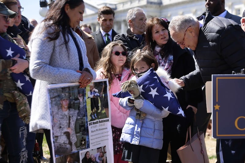 Mr Schumer greets Brielle Robinson. Getty Images / AFP
