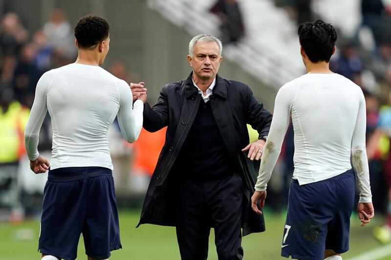 Jose Mourinho (C) of congratulates Dele Alli (L) and Son Heung-m after the 3-1 win over West Ham. EPA