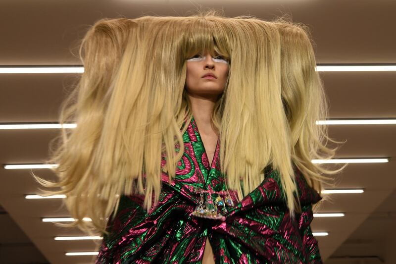 A model presents a creation by designer Matty Bovan during the catwalk show for their Autumn/Winter 2020 collection on the first day of London Fashion Week in London on February 14, 2020. (Photo by DANIEL LEAL-OLIVAS / AFP)