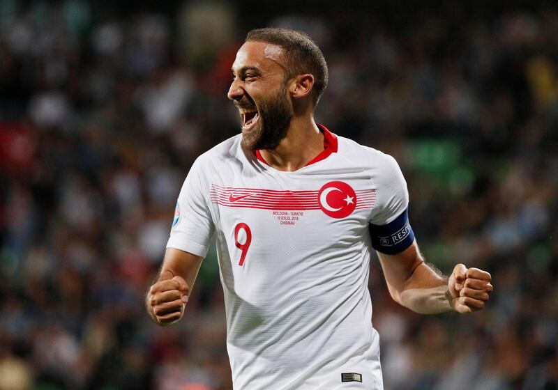 Turkey's Cenk Tosun celebrates scoring their third goal in a 4-0 win. Reuters