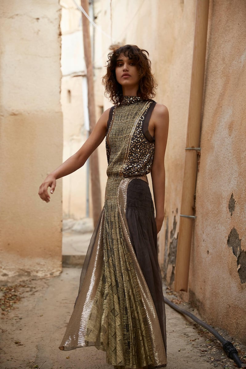 PASSAGE TO OMAN. Photography by Alex Trommlitz; Fashion director | Sarah Maisey

Grit and glamour
Dress, Dh32,600, Chloé. Boots, Dh2,405, Stuart Weitzman