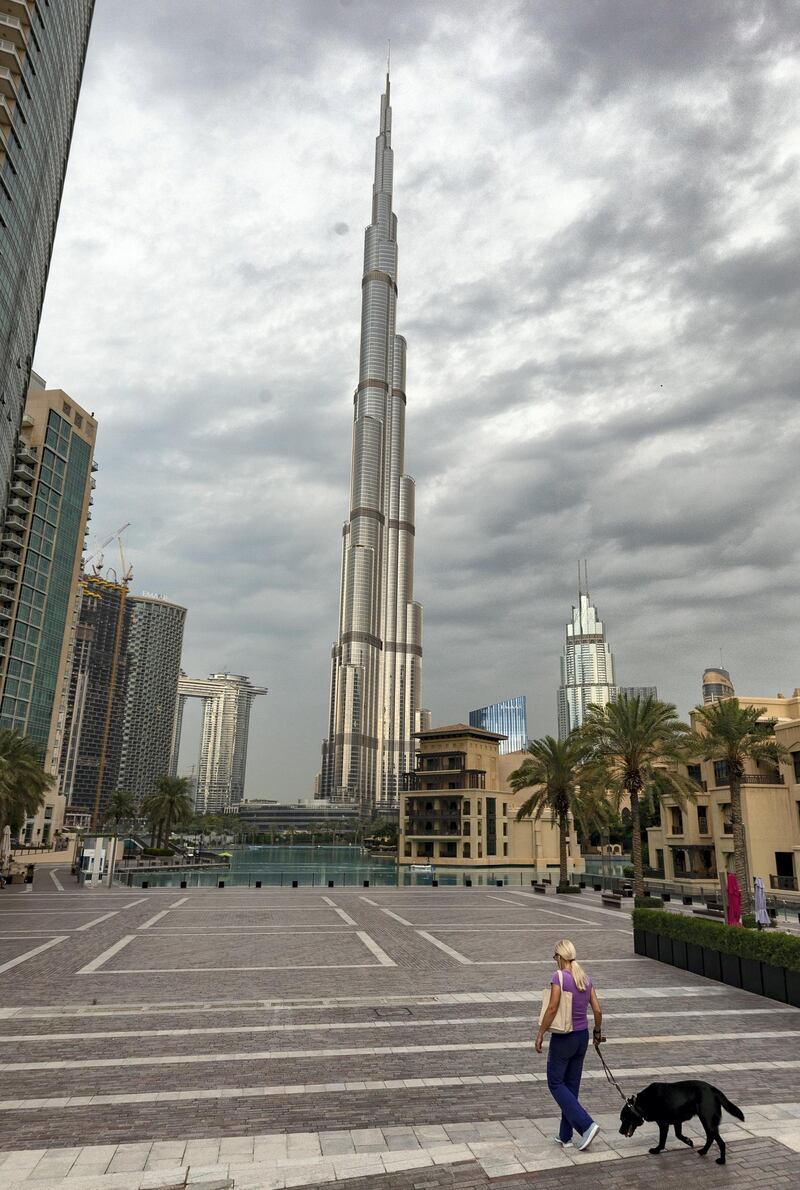 Dubai, United Arab Emirates - Reporter: N/A. Standalone. Dark clouds and rain surround the Burj Khalifa. Tuesday, December 10th, 2019. Downtown, Dubai. Chris Whiteoak / The National