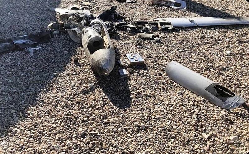 The wrecked remains of one of two armed drones shot down over Ain Al-Asad Air Base in western Iraq in January. Another unmanned aircraft was downed at Baghdad airport on Tuesday. AFP