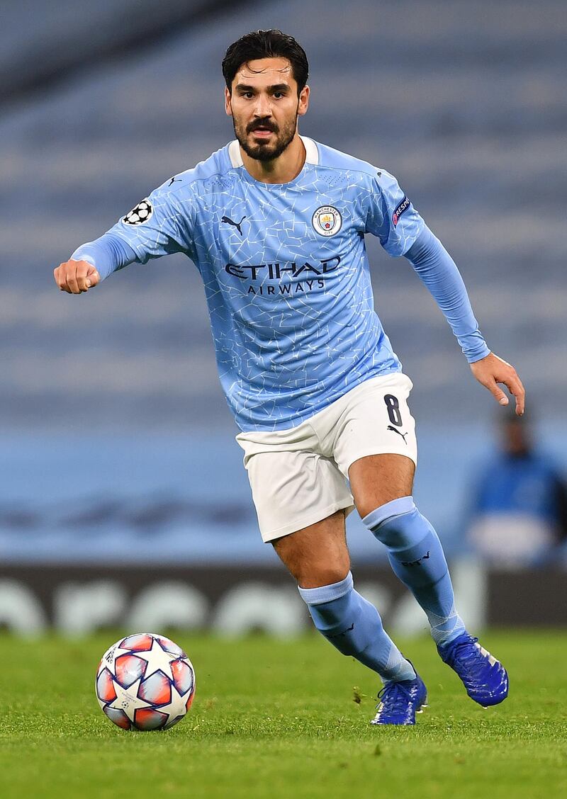 Manchester City's German midfielder Ilkay Gundogan runs with the ball during the UEFA Champions League football Group C match between Manchester City and Olympiakos at the Etihad Stadium in Manchester, north west England on November 3, 2020. (Photo by Paul ELLIS / AFP)