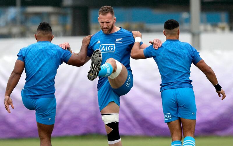 New Zealand's Kieran Read, centre, stretches during training. AP