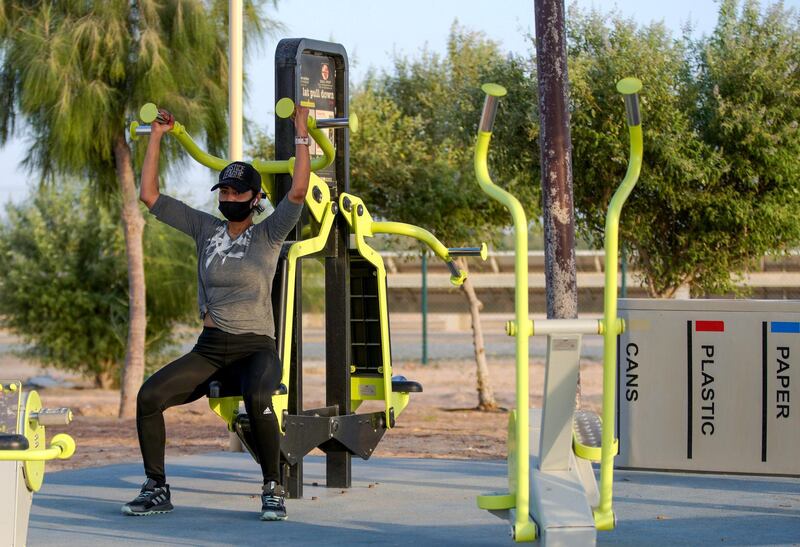 Abu Dhabi, United Arab Emirates, May 26, 2020.  
  Khalifa City residents wearing face masks trying to keep fit during the Eid break at Masdar Park during the Covid-19 pandemic.
Victor Besa  / The National
Section:  Standalone / Stock