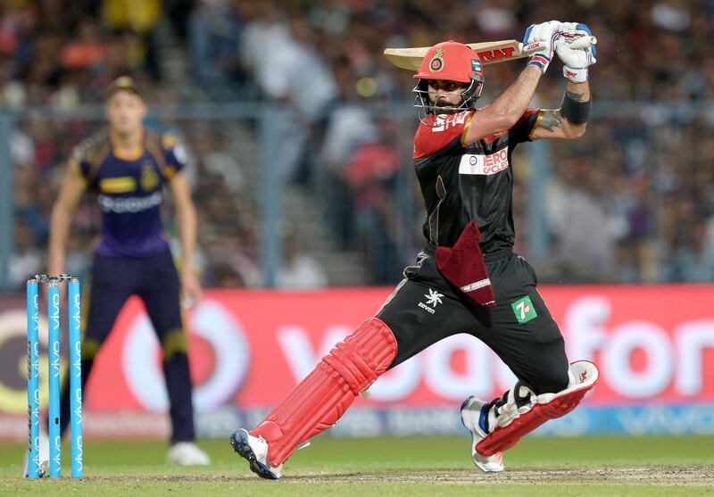 Royal Challengers Bangalore captain Virat Kohli plays a shot during the 2016 Indian Premier League (IPL) Twenty20 (T20) cricket match between Kolkata Knight Riders and Royal Challengers Bangalore at the Eden Gardens Cricket Stadium in Kolkata on May 16, 2016.  ----IMAGE RESTRICTED TO EDITORIAL USE - STRICTLY NO COMMERCIAL USE----- / GETTYOUT (Photo by Dibyangshu SARKAR / AFP)