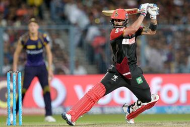 Royal Challengers Bangalore captain Virat Kohli plays a shot during the 2016 Indian Premier League (IPL) Twenty20 (T20) cricket match between Kolkata Knight Riders and Royal Challengers Bangalore at the Eden Gardens Cricket Stadium in Kolkata on May 16, 2016. ----IMAGE RESTRICTED TO EDITORIAL USE - STRICTLY NO COMMERCIAL USE----- / GETTYOUT (Photo by Dibyangshu SARKAR / AFP)