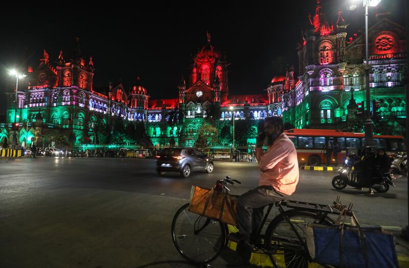 The Chhatrapati Shivaji Maharaj Terminus, a World Heritage Site in Mumbai, illuminated in the colours of the Indian flag. EPA