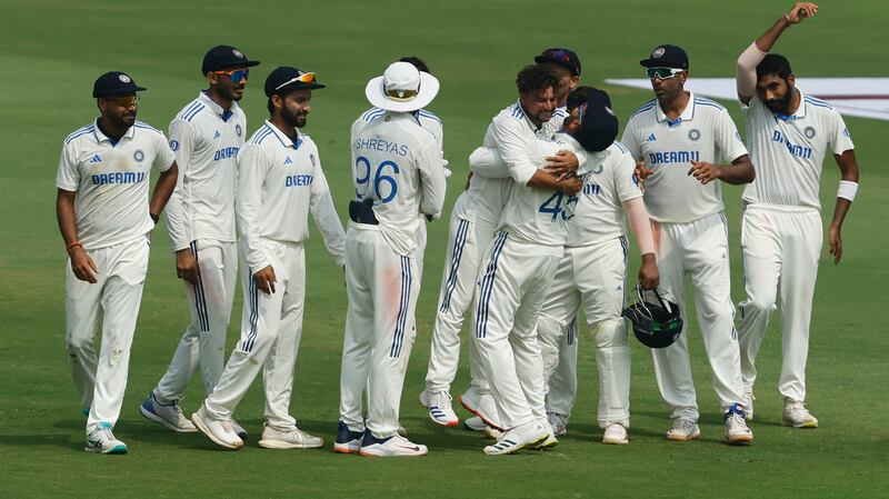 India's Kuldeep Yadav celebrates with teammates after taking the lbw wicket of England opener Zak Crawley, following a successful DRS review. Reuters