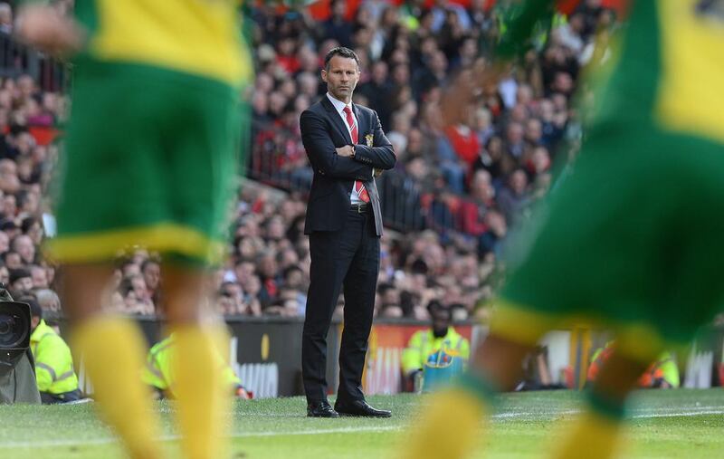 Giggs in the dugout during his brief spell as Manchester United manager, against Norwich City at Old Trafford in April 2014. AFP