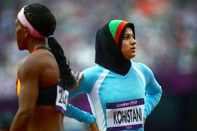 Afghanistan's Tahmina Kohistani (right) after competing in the women's 100m heats during the London 2012 Olympic Games.