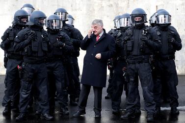 Herbert Reul, centre, Interior Minister of North Rhine-Westphalia, presents the German state’s unit responsible for arrests and securing evidence on February 4, 2019. EPA  