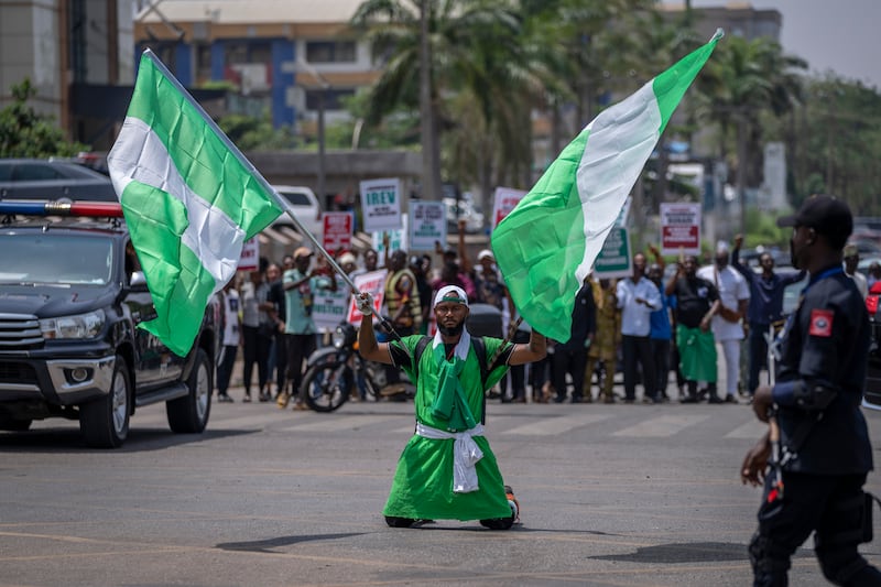 A man takes part in a protest against the electoral commission in Abuja. AP