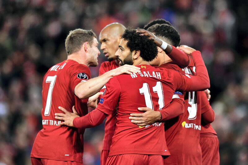 Liverpool's Mohamed Salah celebrates scoring his side's fourth goal of the game with teammates