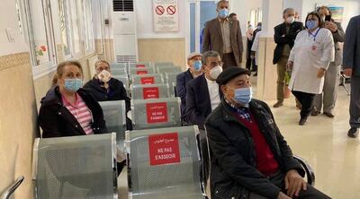 Algerians wait for their turn to get vaccinated against Covid-19 at an immunisation centre in the capital Algiers. Photo: Jafer Saada