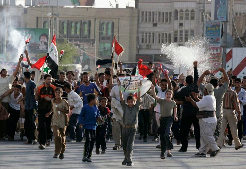Fans take to the streets in Najaf, 160 kilometres south of Baghdad, on July 29, 2007 following Iraq's victory over Saudi Arabia in the 2007 Asian Cup final. Reuters 