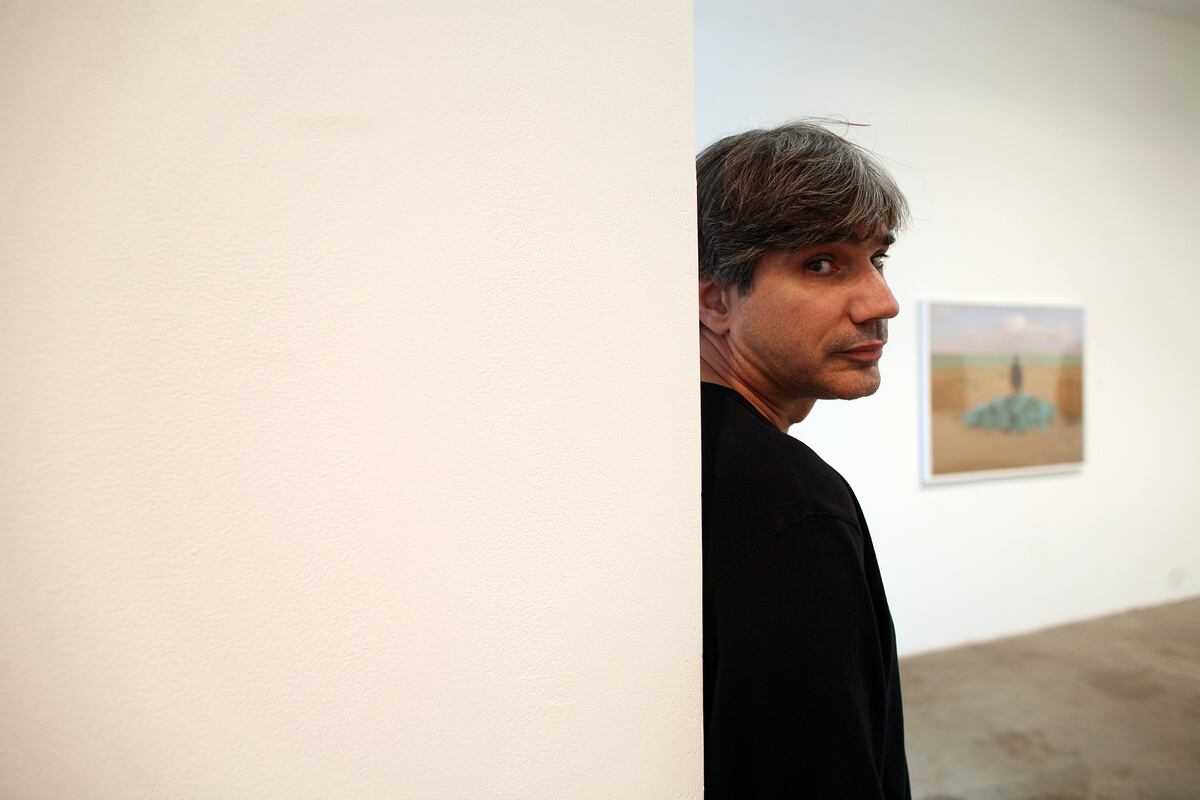 February 12, 2009 / Abu Dhabi / (Rich-Joseph Facun / The National) Tarek Al-Ghoussein (CQ), poses for his portrait amid samples of his work at The Third Line gallery in Dubai, Thursday, February 12, 2009. Al-Ghoussein is a Palestinian-Kuwaiti based in the UAE. His work is currently being exhibited at the gallery from February 12 - March 5, 2009.  *** Local Caption ***  rjf-0212-TAREK002.jpgrjf-0212-TAREK002.jpg