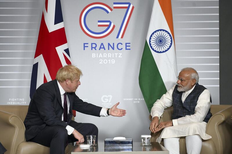 BIARRITZ, FRANCE - AUGUST 25: British Prime Minister Boris Johnson (L) meets Prime Minister of India Narendra Modi for bilateral talks during the G7 summit on August 25, 2019 in Biarritz, France. The French southwestern seaside resort of Biarritz is hosting the 45th G7 summit from August 24 to 26. High on the agenda will be the climate emergency, the US-China trade war, Britain's departure from the EU, and emergency talks on the Amazon wildfire crisis. (Photo by Stefan Rousseau - Pool/Getty Images)