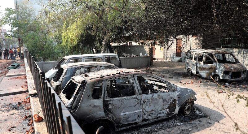 Burnt cars after clashes in New Delhi, India.  At least 24 people have been killed in the fighting that broke out between supporters and opponents of the Citizenship Amendment Act.  EPA