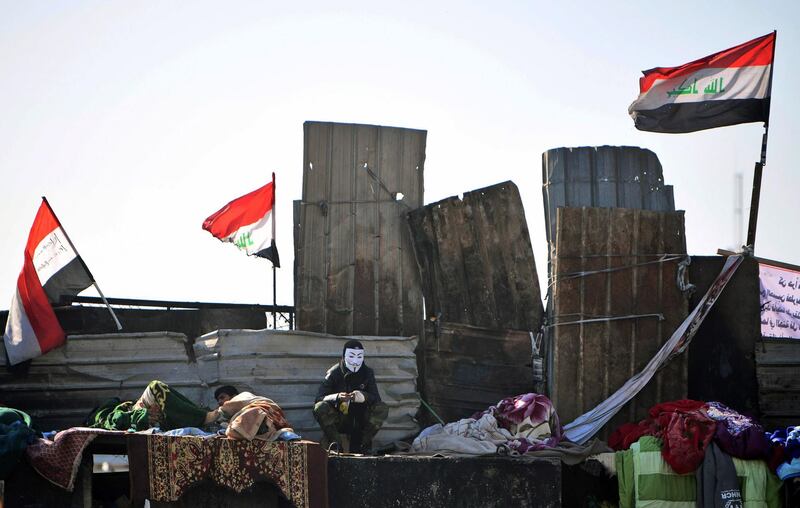 Protesters stand on concrete blocks which are used by security forces to block the Ahrar Bridge (Freemen bridge). EPA