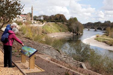 Tourists at a River Tweed and Coldstream Bridge viewing point. The river acts as the border between Scotland and England. Stuart Boulton for The National