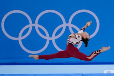 FILE - In this July 25, 2021, file photo, Pauline Schaefer-Betz, of Germany, performs her floor exercise routine during the women's artistic gymnastic qualifications at the 2020 Summer Olympics, in Tokyo.  The German gymnastics team wore full-legged unitards that went down to their ankles, eschewing the traditional bikini cut that ends high on the hip.  The athletes said they were trying to combat the sexualization of young women and girls in their sport, which is trying to recover from a decades-long sexual abuse scandal.  (AP Photo / Gregory Bull, File)