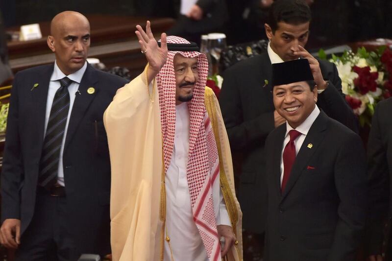 Saudi Arabia's King Salman waves next to Indonesian parliament speaker Setyo Novanto (front right) at the parliament in Jakarta on March 2, 2017. Adek Berry / AFP