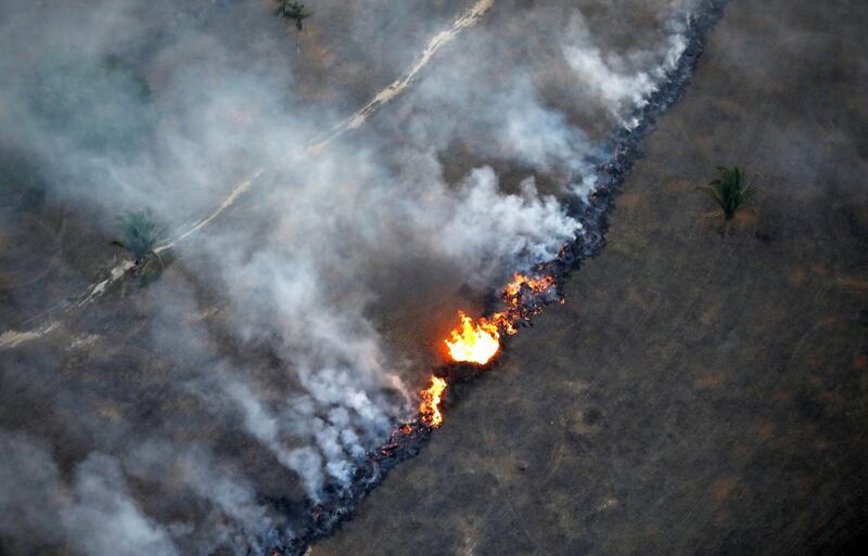 FILE PHOTO: An aerial view shows a fire in an area of the Amazon rainforest near Porto Velho, Rondonia State, Brazil, September 10, 2019. REUTERS/Bruno Kelly/File Photo