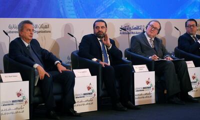 Lebanon's Central Bank Governor Riad Salameh and Lebanon's Prime Minister Saad al-Hariri attend the Lebanon Investment in Infrastructure Conference in Beirut, Lebanon March 6, 2018. REUTERS/Mohamed Azakir