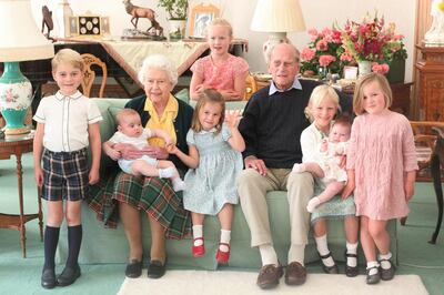 An undated handout picture released by Kensington Palace on April 14, 2021 shows Britain's Queen Elizabeth II and  Britain's Prince Philip, Duke of Edinburgh with their great grandchildren. Pictured (L-R) are Britain's Prince George of Cambridge, Britain's Prince Louis of Cambridge being held by Britain's Queen Elizabeth II, Savannah Phillips (standing at rear), Britain's Princess Charlotte of Cambridge, Britain's Prince Philip, Duke of Edinburgh, Isla Phillips holding Lena Tindall, and Mia Tindall. (Photo by THE DUCHESS OF CAMBRIDGE / KENSINGTON PALACE / AFP) / RESTRICTED TO EDITORIAL USE - MANDATORY CREDIT "AFP PHOTO / KENSINGTON PALACE / DUCHESS OF CAMBRIDGE" - NO MARKETING - NO ADVERTISING CAMPAIGNS  - NO COMMERCIAL USE - RESTRICTED TO SUBSCRIPTION USE - STRICTLY NO SALES - DISTRIBUTED AS A SERVICE TO CLIENTS - NOT FOR USE AFTER DECEMBER 31, 2021. / 