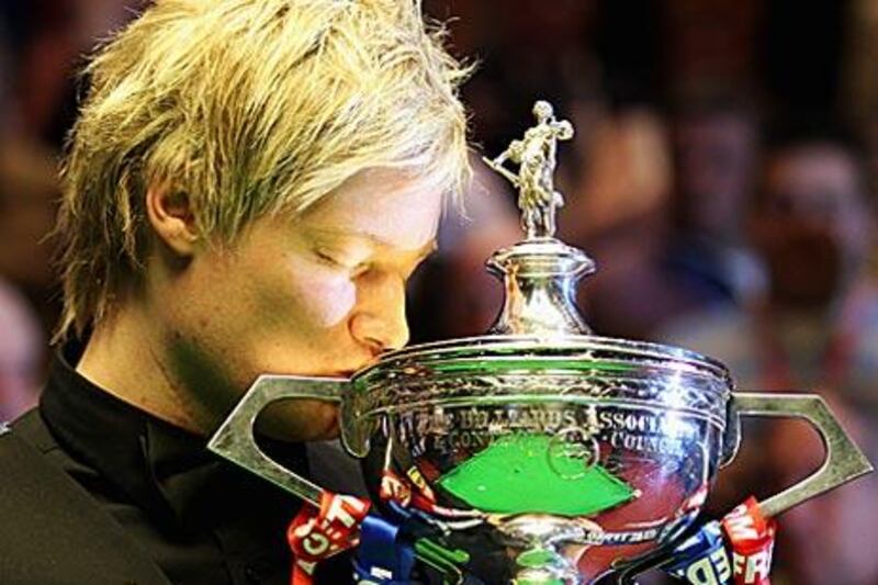 Neil Robertson kisses the World Championship trophy after his 18-13 victory over Graeme Dott.