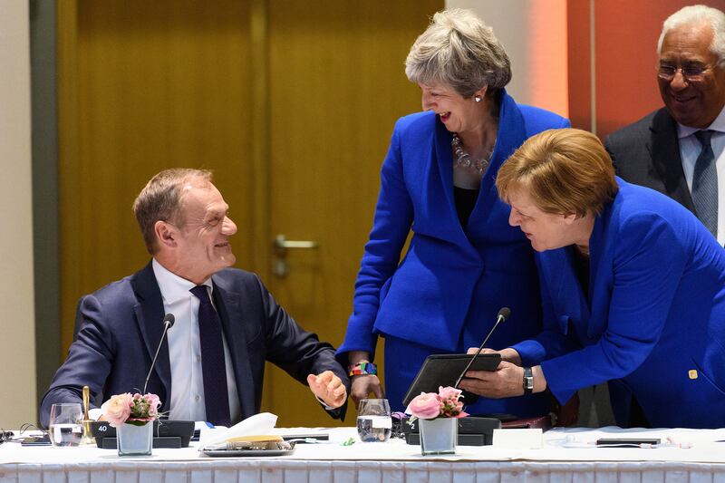Mr Tusk meets Theresa May and Angela Merkel – who were UK prime minister and German chancellor at the time – for a round-table meeting in 2019 in Brussels. Getty Images