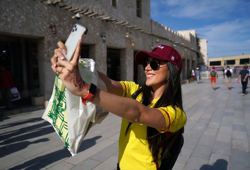 A fan takes a selfie at a souq in Doha before a day of more World Cup action. PA