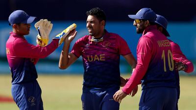Zahoor Khan of the UAE celebrates with teammates after taking the wicket of Tomas Mackintosh of Scotland. Photo: ICC