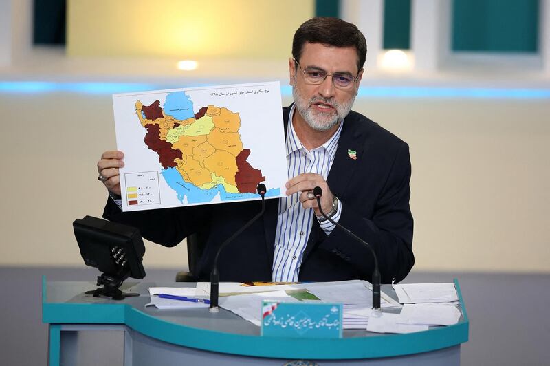 Mr Ghazizadeh Hashemi, also an MP, uses a map as a visual aid. AFP