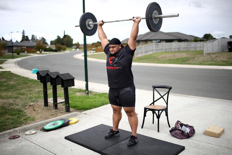 TE KAUWHATA, NEW ZEALAND - APRIL 08: New Zealand Weightlifter David Liti training in isolation on the road and driveway outside his home due to the Coronavirus lockdown on April 08, 2020 in Te Kauwhata, New Zealand. New Zealand has been in lockdown since Thursday 26 March following tough restrictions imposed by the government to stop the spread of COVID-19 across the country.  A State of National Emergency is in place along with an Epidemic Notice to help ensure the continuity of essential Government business. Under the COVID-19 Alert Level Four measures, all non-essential businesses are closed, including bars, restaurants, cinemas and playgrounds. Schools are closed and all indoor and outdoor events are banned. Essential services will remain open, including supermarkets and pharmacies. Lockdown measures are expected to remain in place for around four weeks, with Prime Minister Jacinda Ardern warning there will be zero tolerance for people ignoring the restrictions, with police able to enforce them if required. (Photo by Phil Walter/Getty Images)