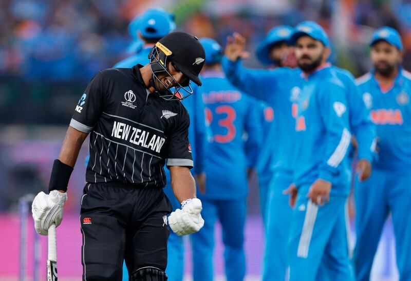 New Zealand's Rachin Ravindra reacts after losing his wicket. Reuters
