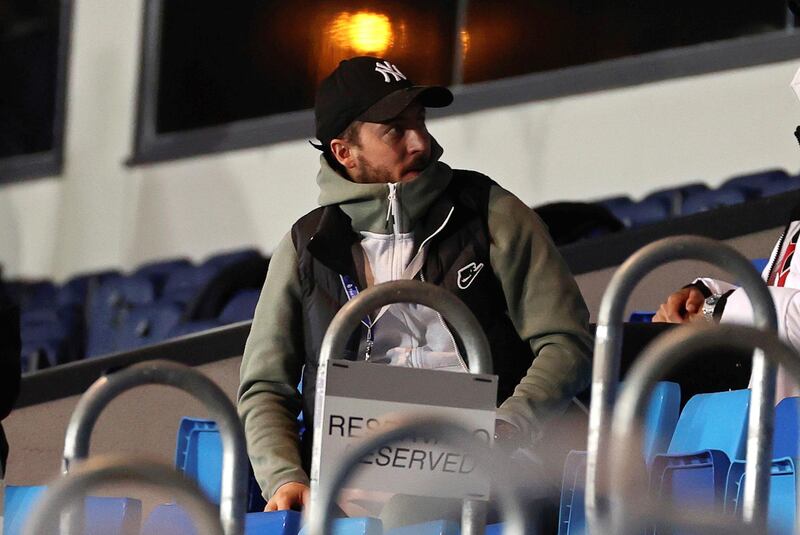 Injured Real Madrid attacker Eden Hazard sits in the stands during the match. EPA