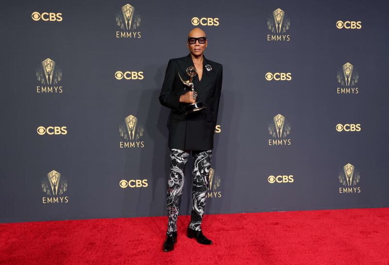 RuPaul wore a black double-breasted jacket with a white swirl pattern on his pants. AFP