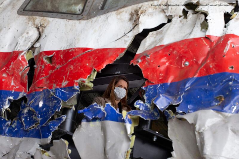 Trial judges and lawyers inspect the reconstructed wreckage of Malaysia Airlines Flight MH17 at the Gilze-Rijen Airbase, southern Netherlands. AFP